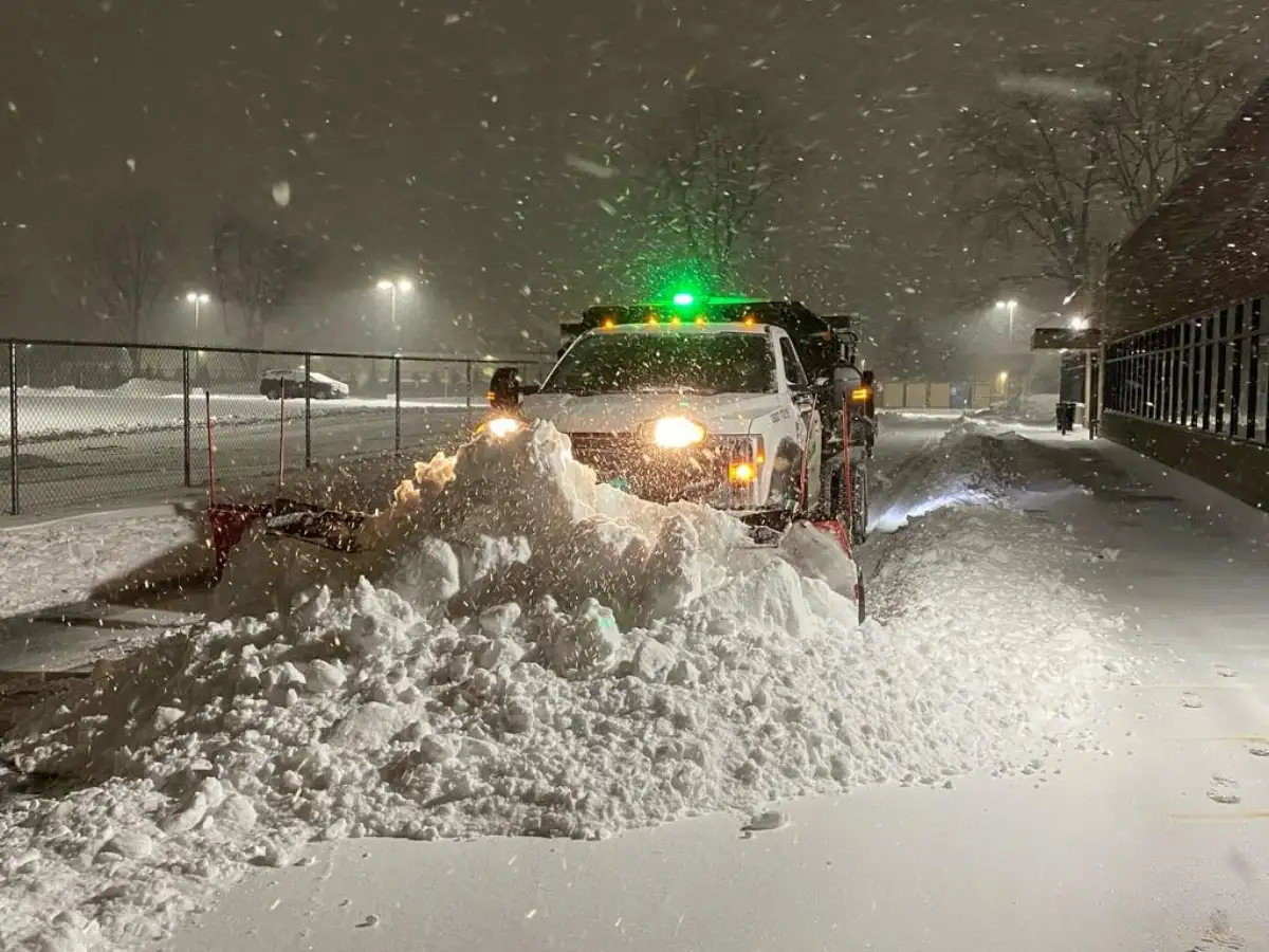 Salt spreader treating a commercial parking lot for ice