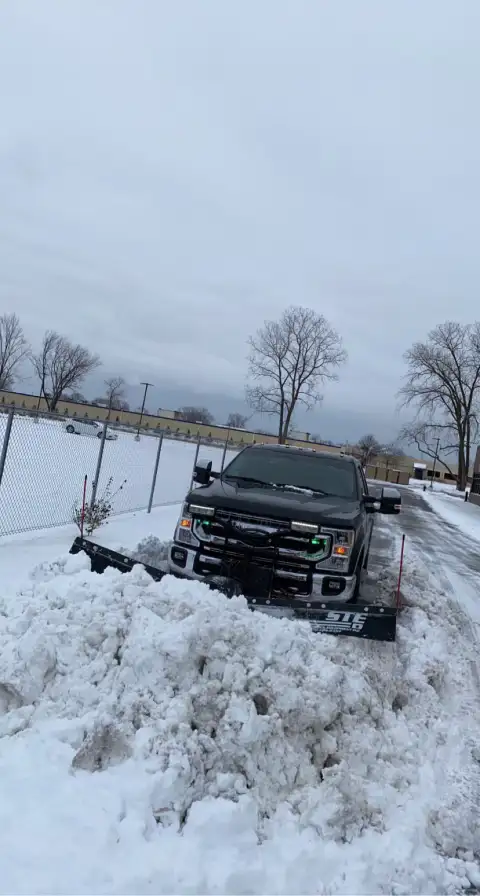 Heavy snow removal in commercial parking lot