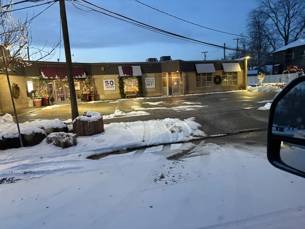 Cleared commercial area with winter snow banks after service