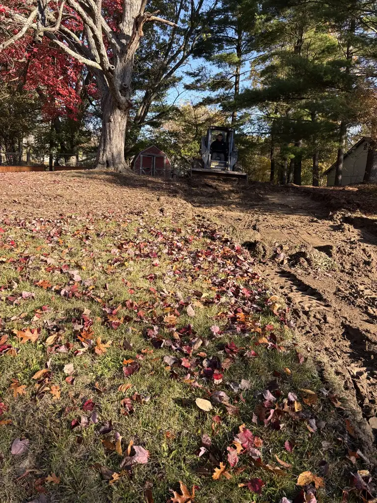 French drain installation trench with perforated pipe and gravel backfill