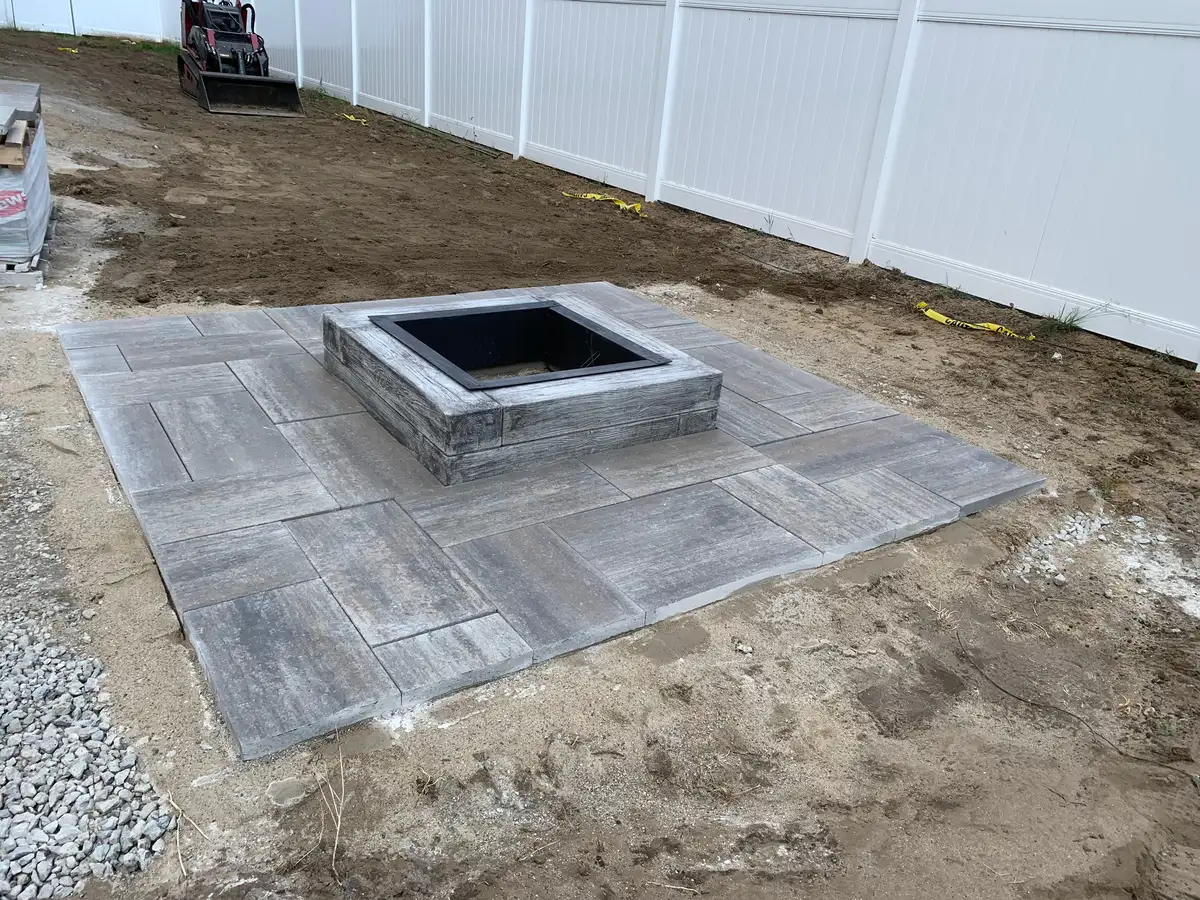 Stone fire feature with patio seating area