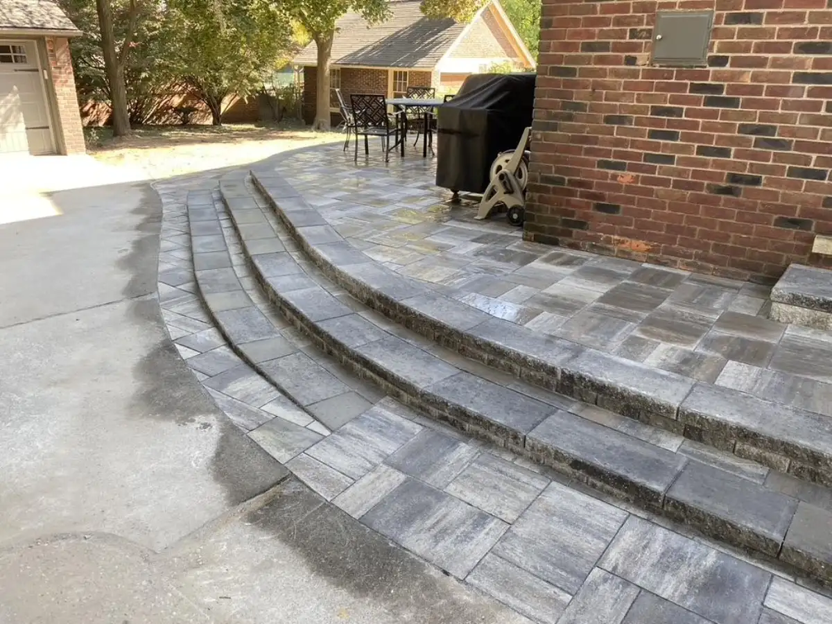 Elevated paver patio with curved steps and professional craftsmanship