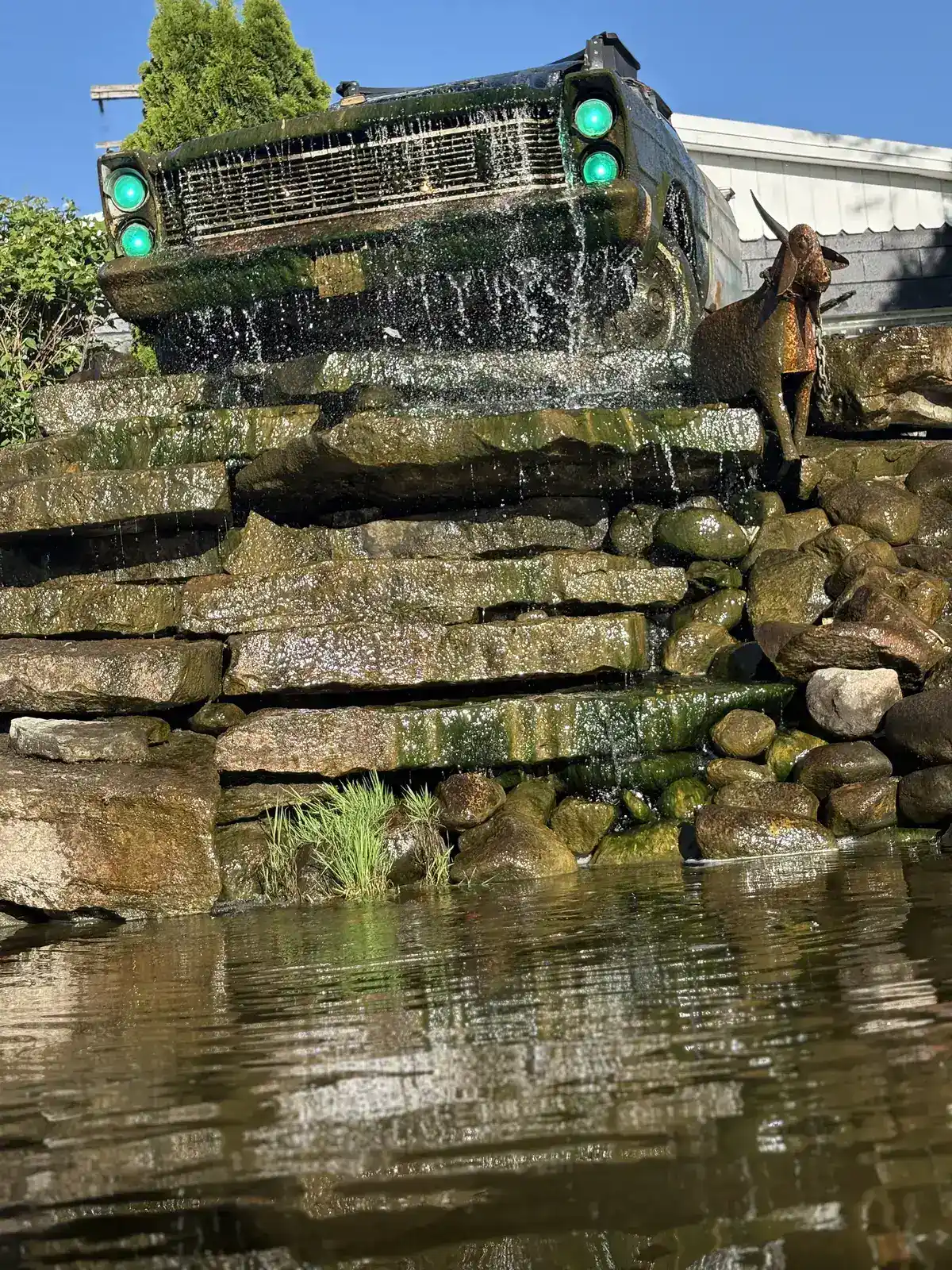 Signature vintage truck waterfall — custom water feature by The Guy Outdoor Services