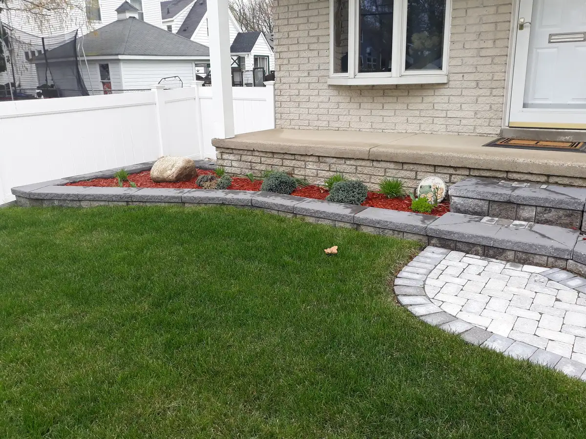 Restored lawn beside a residential walkway