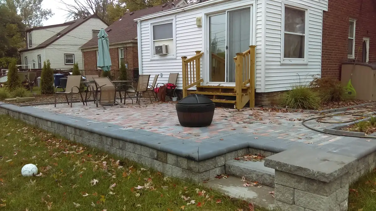 Elevated patio with fire pit and block retaining wall seating area