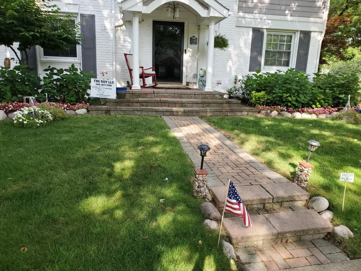 Landscape design integrated with paver walkway and patio