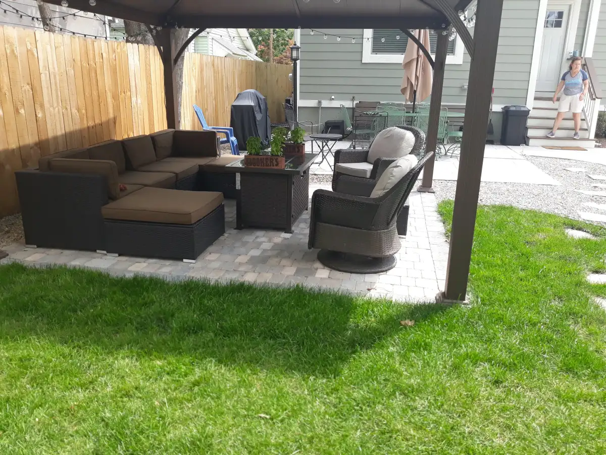 Completed brick paver patio with seating wall in Metro Detroit