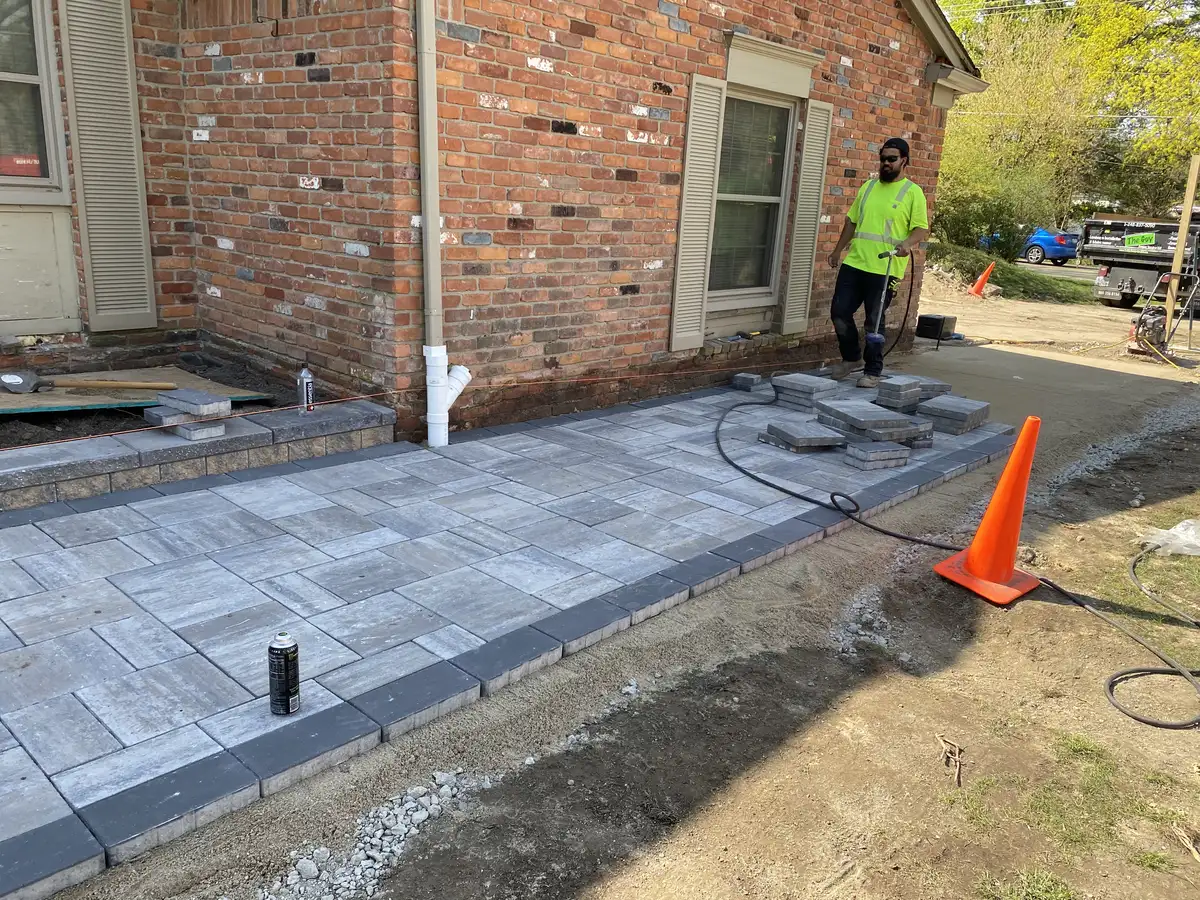 Custom designed patio with fire feature and seating walls in Metro Detroit