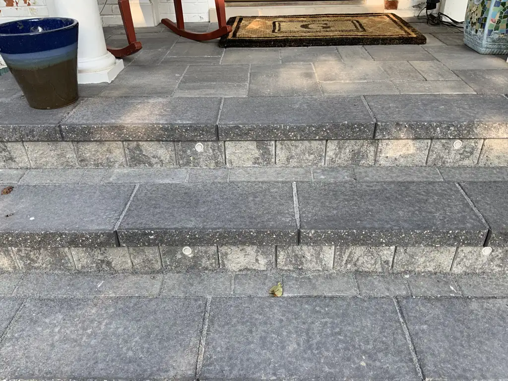 Paver steps with built-in LED step lights for landscape lighting